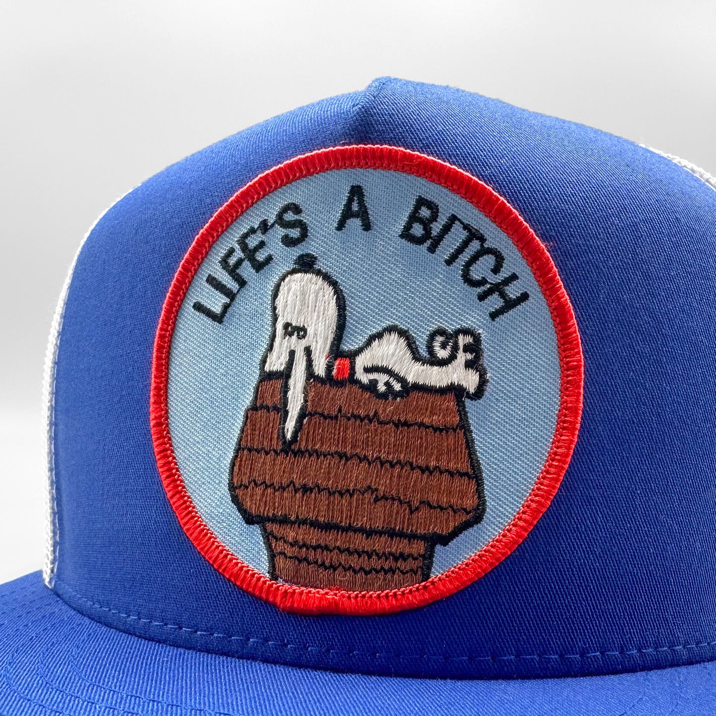 Life's a Bitch Trucker Hat